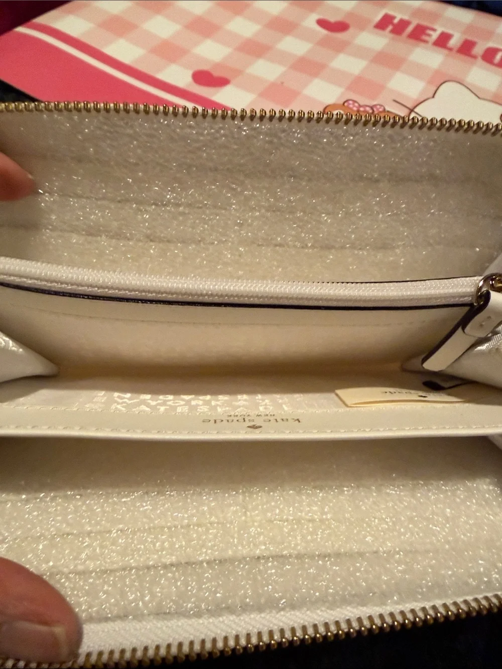 kate spade White Pebbled Leather Zip Wallet with Black Bow and Gold Bar